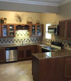 the kitchen is clean and ready for us to use in its new owner's home