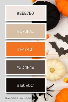 some pumpkins and other halloween decorations on a white surface with the words eeeezeo