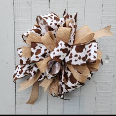 a brown and white cow print bow on a door