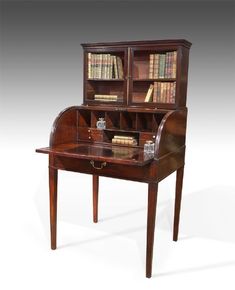 an old wooden desk with bookshelves and drawers on it's top shelf