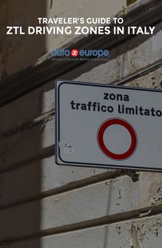 a sign on the side of a building that says travel's guide to zil driving zones in italy