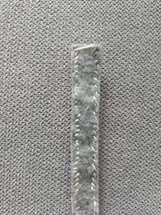 a piece of fabric that has been stitched into the back side of a watch