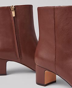 Elevate your style with the Ann Taylor Block Heel Leather Bootie, a perfect blend of luxury and comfort. These booties feature a sophisticated pebble brown leather that complements any outfit.

- Size: 7 1/2
- Color: Pebble Brown
- Material: Leather
- Gender: Female
- Heel Height: 2 1/4 inches
- Design: Pointy toe with an inside zip
- Comfort: Padded footbed for enhanced comfort

Crafted for the modern woman, these booties are designed to provide both style and comfort. The block heel offers sta Female Features, Go The Extra Mile, Brown Booties, Extra Mile, Comfort Design, Leather Block Heels, Shoe Obsession, Shoes Booties, Petite Fashion