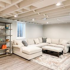 a living room filled with furniture and a large rug