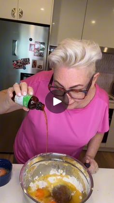 an older woman pouring something into a bowl