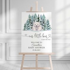 a baby shower sign with a bear on it