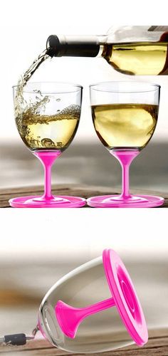 two wine glasses filled with white wine being poured into them