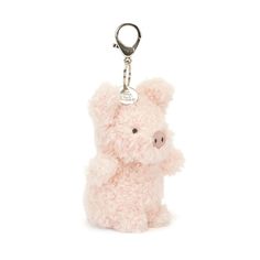 a pink teddy bear keychain with a metal hook on it's side