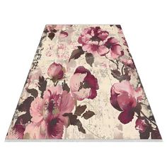 an area rug with pink flowers on it