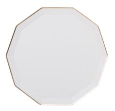 an octagonal white plate with gold trim on the edges and sides, isolated against a white background