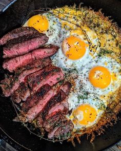 steak, eggs and hash browns in a skillet