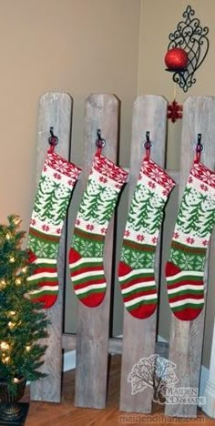 an image of christmas stockings on wooden slats