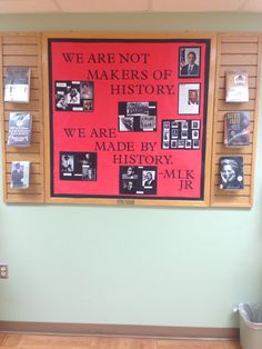 a bulletin board with pictures on it in an office building that reads we are not makers of history, we are made by history