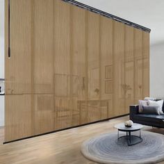 a living room filled with furniture and a sliding door