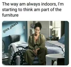 a woman sitting on top of a bed in a room