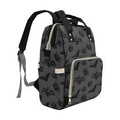 a black and white backpack with bats all over it's front pocket, zippers at the bottom