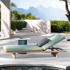 a chaise lounge chair sitting on top of a pool