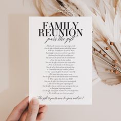 a person holding up a piece of paper with the words family reunion printed on it