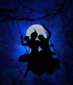 two people are silhouetted against the night sky with trees and moon in the background