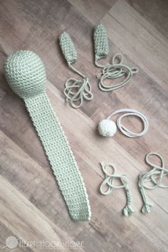 crocheted items are laid out on the floor to be used as knitting accessories