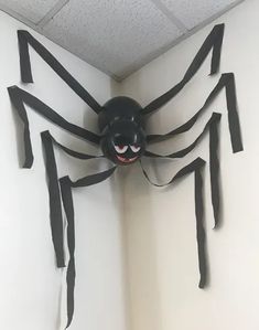 a spider made out of duct tape on the wall