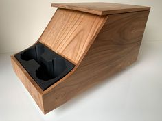 an open wooden box with two compartments on the inside and one compartment in the outside