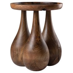 three wooden vases sitting on top of a table