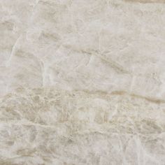 a white marble textured surface with some brown lines on the top and bottom part