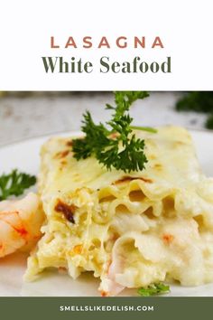 a white plate topped with pasta and shrimp next to parsley on top of it