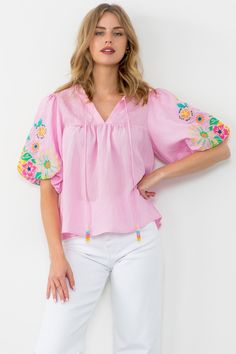 The Poppy Blouse features puff sleeves with beautiful floral embroidery. Body Length: 23 1/2 in Bust Width: 39 in Sleeve Length: 13 in Summer 2025, Trendy Fashion Tops, Embroidery Top, Dress Indian Style, Fashion Attire, Indian Fashion Dresses, Embroidery Fashion, Tie Top, Floral Embroidery