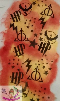 the harry potter symbol is painted on paper with stars and lightnings in red, yellow, and black