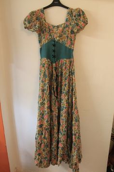 Really beautiful floral maxi dress, from the 1940s but has a real 60s/70s look to it also. 24 inch waist. 60 inches from shoulder to hem There are parts where it is coming apart at the seams a little as shown in the last picture, but this is very easily fixed. 1940s Looks, 70s Look, 70s Maxi Dress, Corset Waist, Garden Party Dress, 70s Dress, Floral Maxi, Floral Maxi Dress, Dresses Xs