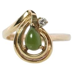 Vintage from the 1990s Materials: Stone Gemstone: Jade Gem color: Green Style: Minimalist Wonderful Apple Green Jade Cabochon ring. Jade is translucent green color. Prong set. Diamond accent on the top. 2.7grams total weight 4mm by 6mm pear cabochon 2mm Diamond Hallmarked and tested 10k sz6.5 10k Gold Ring, Victorian Rings, Cabochon Ring, Jade Ring, Modern Ring, Green Agate, Onyx Ring, Jade Green, Round Cut Diamond