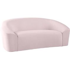 a pink couch sitting on top of a white floor