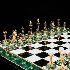 a chess board with green and gold pieces