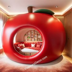 an apple shaped living room with red couches