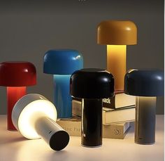 several different colored lamps sitting next to each other