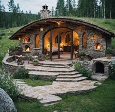 an outdoor living area with stone steps leading up to it