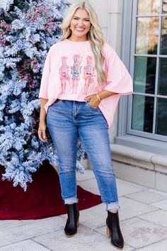 Get festive with our Nutcracker Christmas Boyfriend Tee in dusty pink! This oversized graphic tee features three charming nutcrackers in multicolored outfits and pink bows! With a soft round neckline and short sleeves, it's the perfect cozy addition to your holiday wardrobe! Spread some cheer this season! 100% Cotton Multicolored Outfits, Christmas Boyfriend, Graphic Tee Outfits, Oversized Graphic Tee, Pink Bows, Tunic Sweatshirt, Jumpsuit Party, Holiday Wardrobe, Nutcracker Christmas