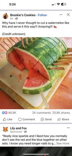 the watermelon is cut in half and placed on top of a cutting board