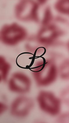 the letter b is placed in front of a floral background