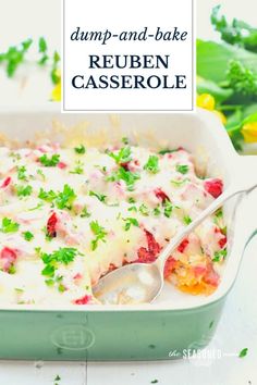 a green casserole dish filled with meat and vegetables, topped with parsley