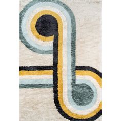 a white rug with blue, yellow and black circles on it's edges in the shape of a letter p