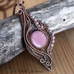 "ROMANTICA Boho necklace with rhodonite in oxidized antiqued copper wire. Handmade vintage style pendant; wire wrapped copper pendant with rhodonite focal and beads. 3 1/4\" X 1 1/4\" (8.3 X 3.4 cm) This pendant comes ready to wear with a copper chain of 18\" length (contact me if you prefer a different chain length). Thank you!" Elegant Pink Wire Wrapped Necklace, Bohemian Pink Wire Wrapped Necklace, Bohemian Copper Wire Wrapped Crystal Necklaces, Bohemian Wire Wrapped Copper Wire Necklace, Rhodonite Jewelry, Bohemian Nickel-free Copper Wire Necklaces, Copper Chain Necklace, Starfish Necklace, Diy Jewelry Inspiration