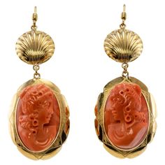 This gorgeous pair of earrings is finely crafted in solid 18K Yellow gold, they also have Italian marks. The genuine Coral high profile cameos measure 22mm x 15mm. They are highly detailed and very well made. The bottom dangling part of each earring measures 1-1/8 inches long including a gold frame. The upper part is 9/16 inches long. The entire earring's length is almost 2 inches long including gold hook. The earrings are in excellent condition and they weigh 14.4 grams. Luxury Coral Jewelry, Luxury Antique Coral Jewelry, Luxury Coral Classic Jewelry, Luxury Bohemian Red Coral Jewelry, Luxury Classic Red Coral Jewelry, Luxury Coral Bohemian Jewelry, Luxury Oval Red Coral Jewelry, Sea Coral Jewelry, Luxury Bohemian Coral Jewelry