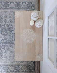 an overhead view of a table with plates and bowls on it next to rugs