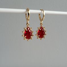 Ruby Red & Crystal Teardrop Teardrop Jewel Huggie Hoop Earrings, 14k Gold Plated Earrings, Vintage Style Earrings, Victorian Earrings  Product specifications: * Material: 14K Gold Plated Brass * Size Each charm measures 1.2 cm x 0.8cm Earring Options: * 8mm inner diameter hoops * 10mm inner diameter hoops Packaging and Gifts: * All pieces of jewellery are sent in a mesh jewellery pouch with a thank you card.  Shipping: * All Australian orders will be shipped out within 1 - 3 days by standard unt Red Teardrop Hoop Earrings, Red Teardrop Hoop Earrings For Pierced Ears, Red Teardrop Hoop Earrings With Ear Wire, Teardrop Clip-on Hoop Earrings Gift, Clip-on Teardrop Hoop Earrings Gift, Ruby Gold Earrings, Victorian Earrings, Vintage Style Earrings, Ruby Earrings