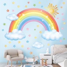 a child's bedroom with a rainbow and stars wall sticker on the wall