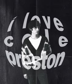 a man standing in front of a black and white photo with the words love cole preston on it