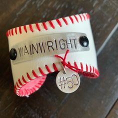 a baseball ornament with a tag attached to it